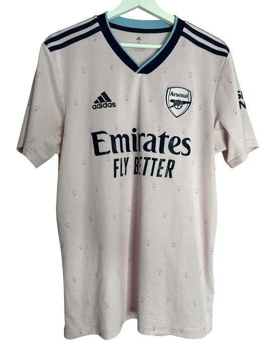 Maillot de football rose Arsenal par Levestiairedupeuple avec motif hermine, col en V et logo Adidas officiel.