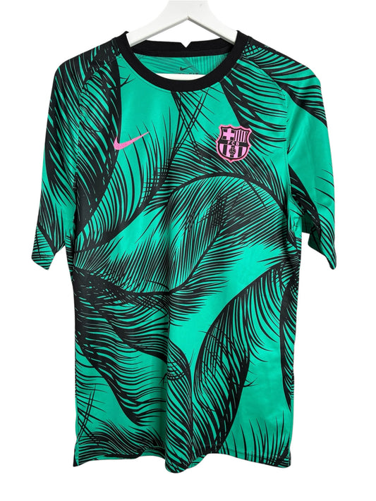 Maillot d'entraînement Nike FC Barcelona Levestiairedupeuple vert émeraude avec motif tropical noir et détails roses.