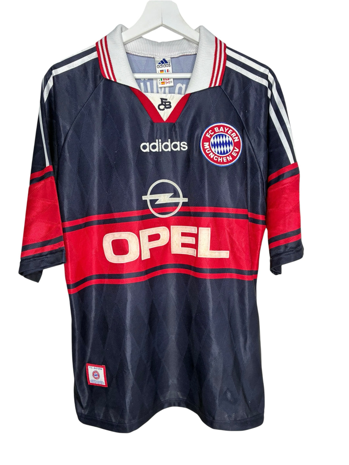 Maillot de football vintage Levestiairedupeuple Bayern Munich bleu marine et rouge avec logo Opel et col polo