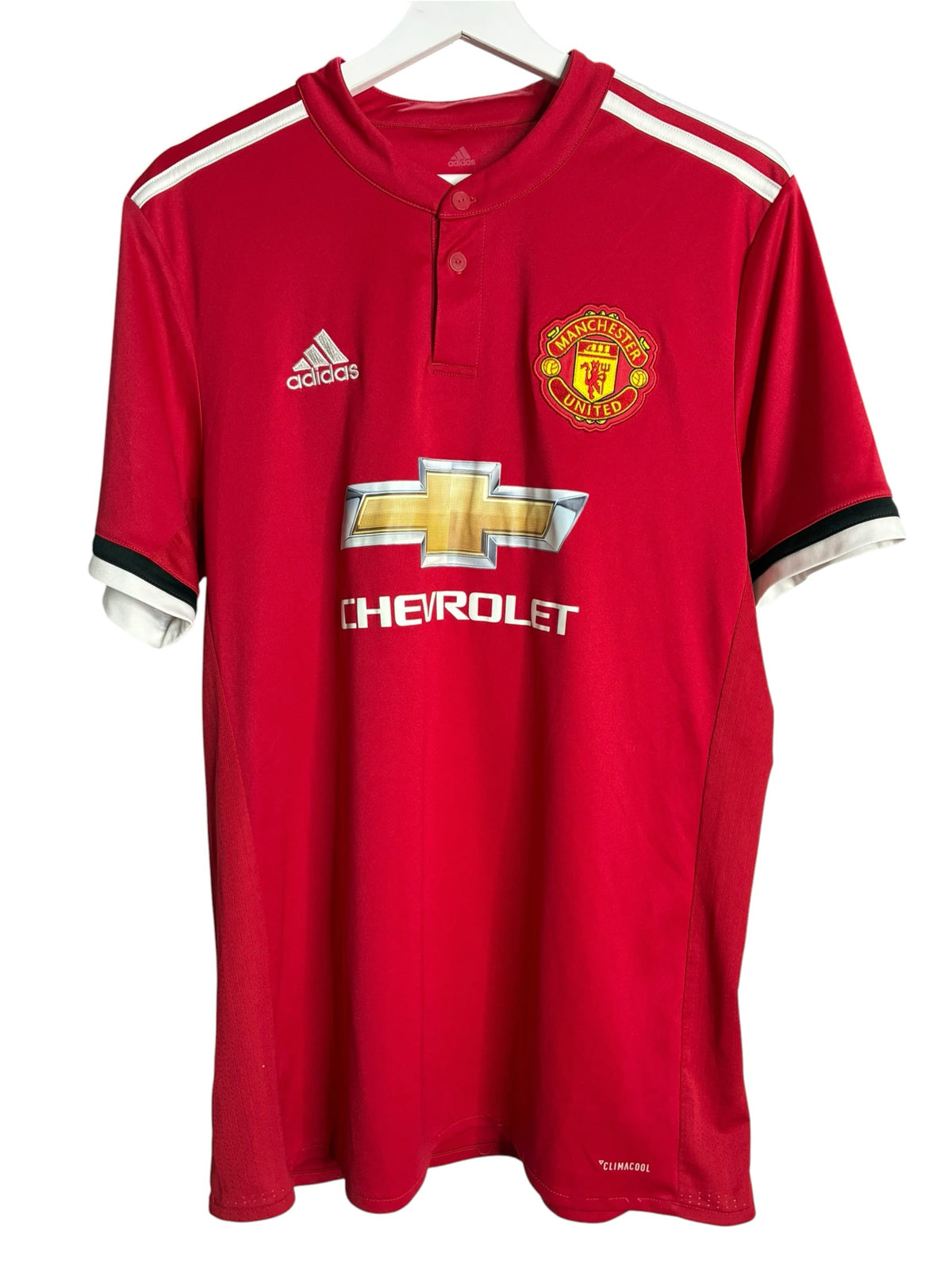 Maillot de football officiel Manchester United rouge Levestiairedupeuple avec blason brodé et détails blancs