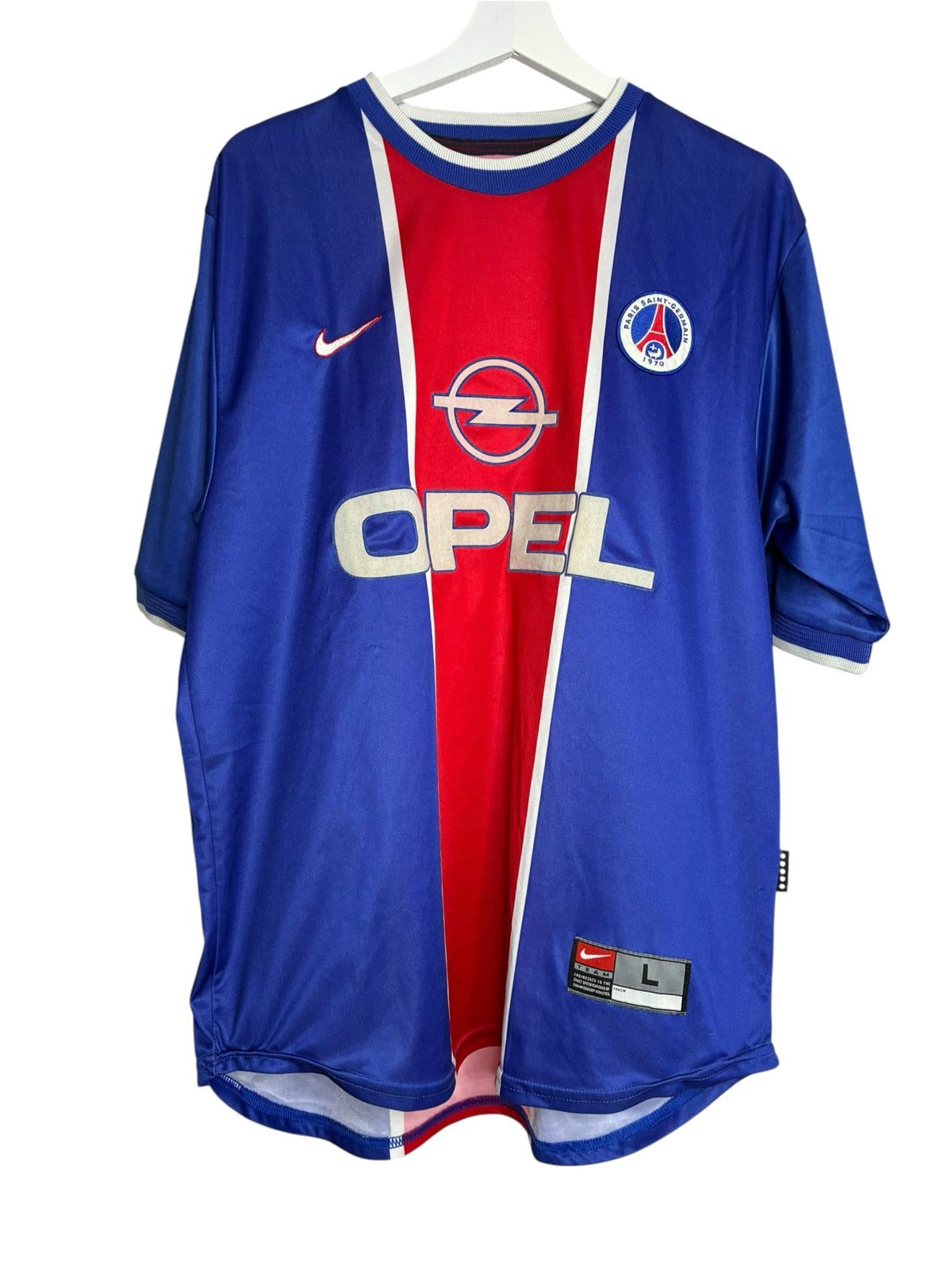 Maillot de football vintage Levestiairedupeuple du PSG bleu, blanc et rouge avec logo Nike et sponsor Opel